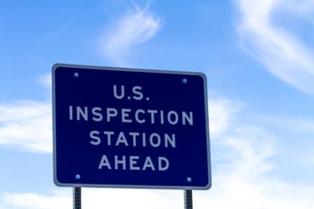 Road sign saying US Inspection Station Ahead