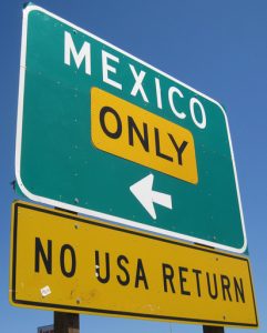 Street sign pointing toward Mexico