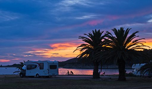RV camped on ocean bay in Baja at sunset